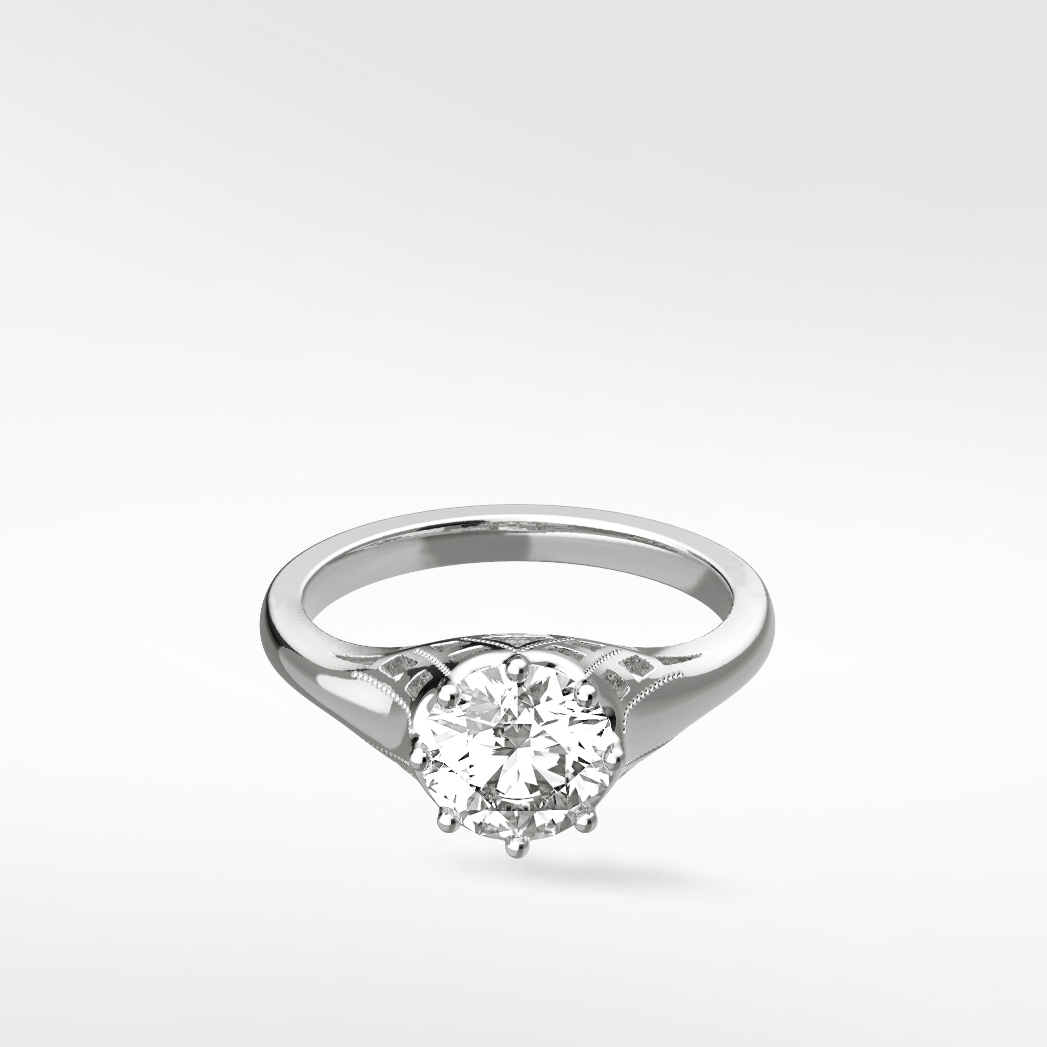 A vintage-style Mondo Engagement Ring in white gold, featuring a round brilliant diamond in a six-prong setting.